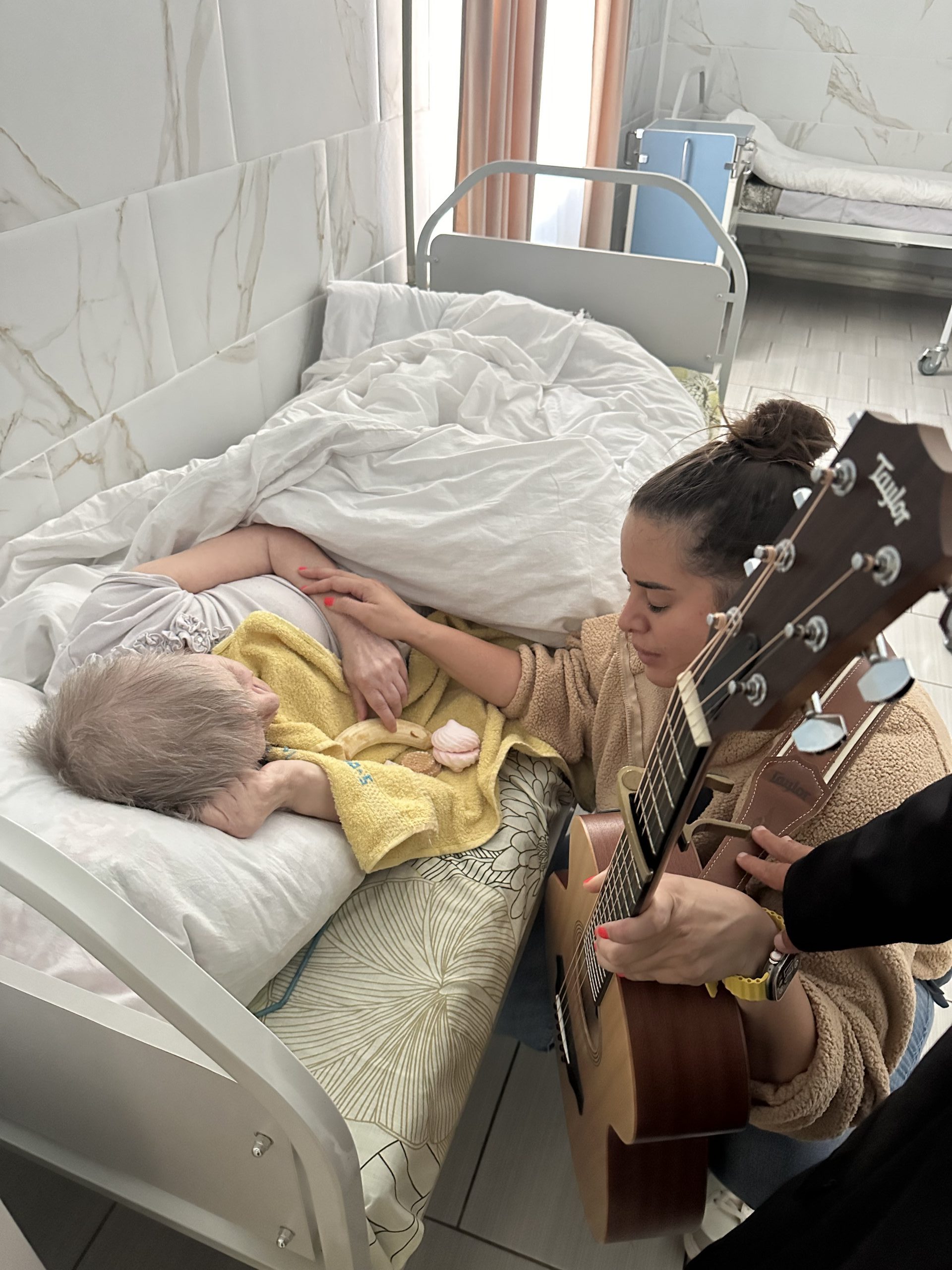 IMG_3778 Boy with walker hugging woman.